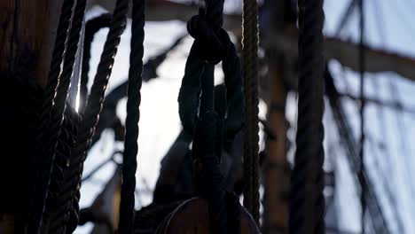 Old-warship-rigging-at-sea-concept-with-solar-glare-time-passing-concept-shot