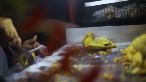 Shot-of-a-street-vendor-cooking-and-selling-their-deep-fried-Indonesian-food-on-the-streets-of-Jakarta