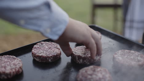 cooking burgers outdoors
