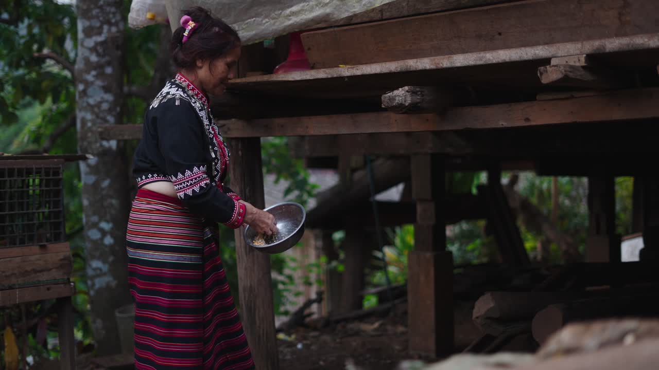 Woman in traditional clothing holding a bowl
