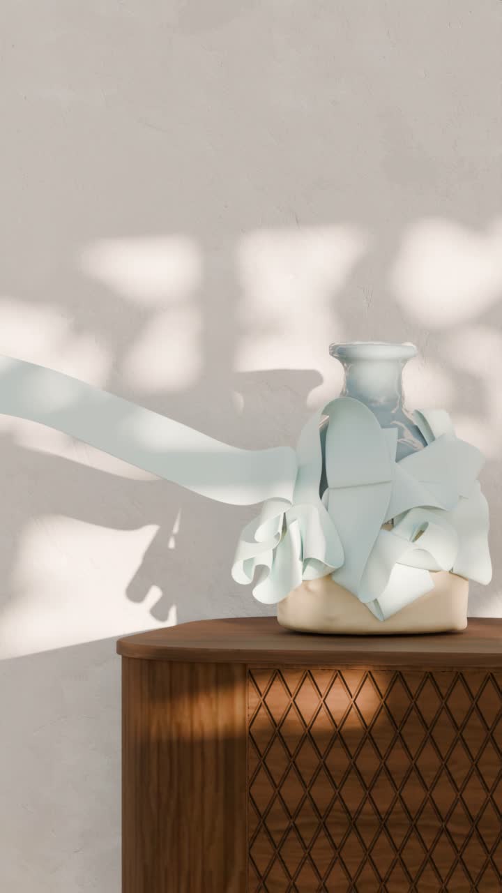 Vase with ribbon on cabinet