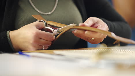 cutting leather with scissors