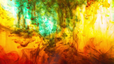 green red and orange paint or dye dropped into water against white background to create swirling colourful smoke background 1