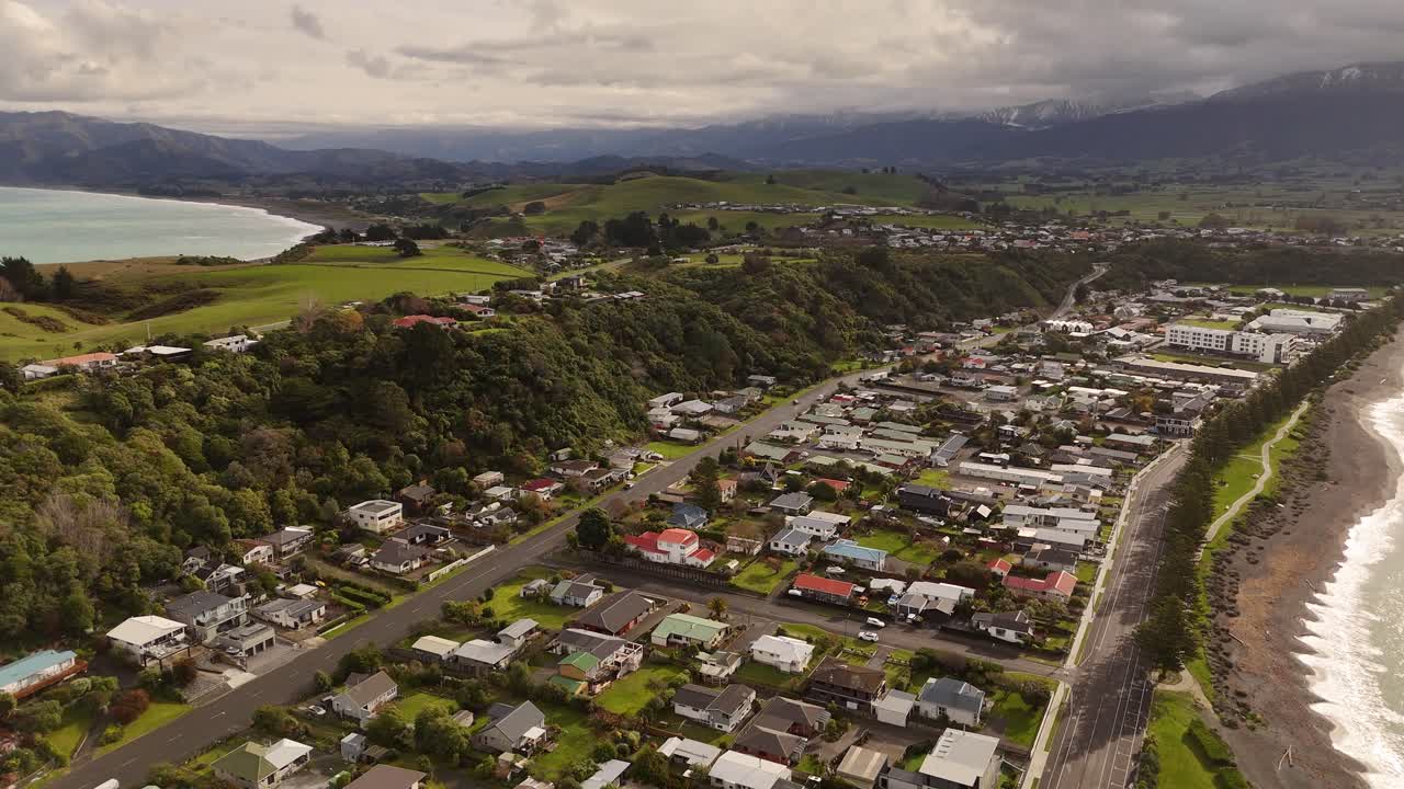 Kaikoura coastal town, peninsula, New Zealand. Aerial backward