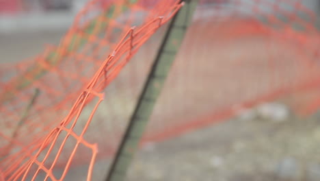 close up on focused orange fencing with a blurred background in ontario toronto canada