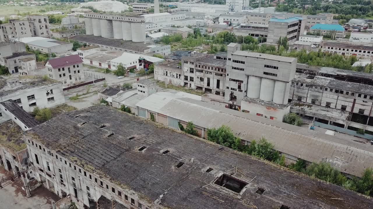 Flight over the destroyed factory. Old industrial building for demolition. Aerial view
