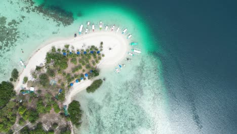 top down view of tropical pass island sandbank in coron, slow drone descend