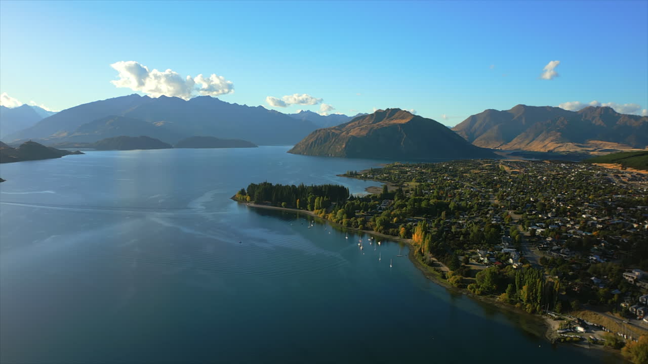 Lake Wānaka and the town of Wanaka in the Otago region of South Island, New Zealand - aerial parallax