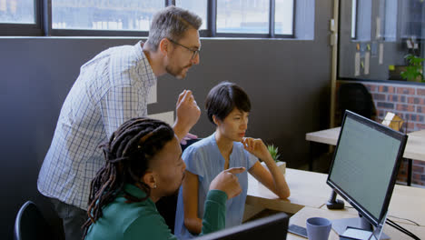 business people discussing over computer in office 4k