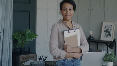 smiling businesswoman in home office