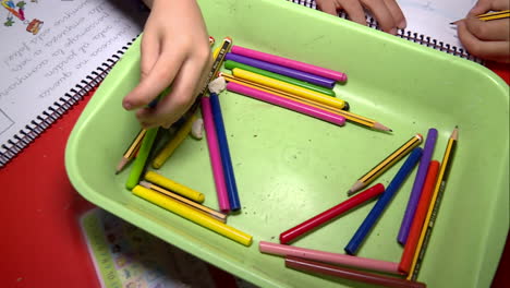 children doing school work with drawing tools