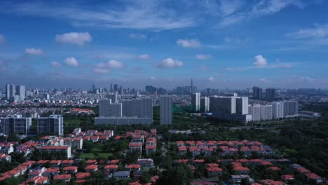 aerial tracking shot of saigon city skyline from phu my hung area of ho chi minh city, vietnam on a beautiful sunny morning