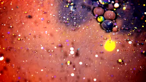 abstract colorful acrylic and food paint bubbles on water