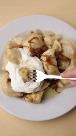 pierogi with sour cream and caramelized onions