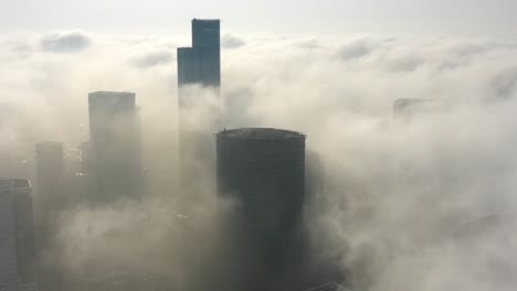 cityscape shrouded in morning fog