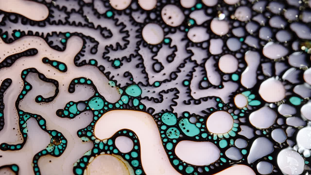 Colorful abstract liquid patterns, close-up macro shot showcasing fluid mixing