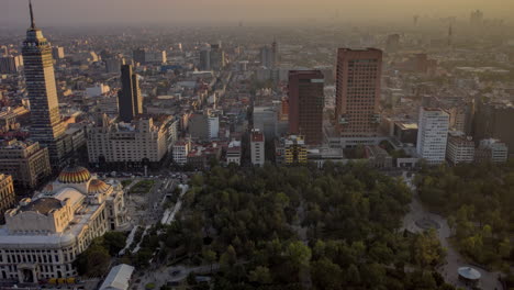 Aerial-Hyperlpase-Of-The-Alameda-Central-Park,-Palacio-De-Bellas-Artes-And-Torre-Latinoamericana