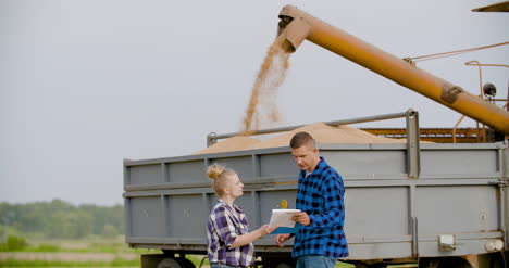 Young-Farmers-Discussing-At-Wheat-Field-3