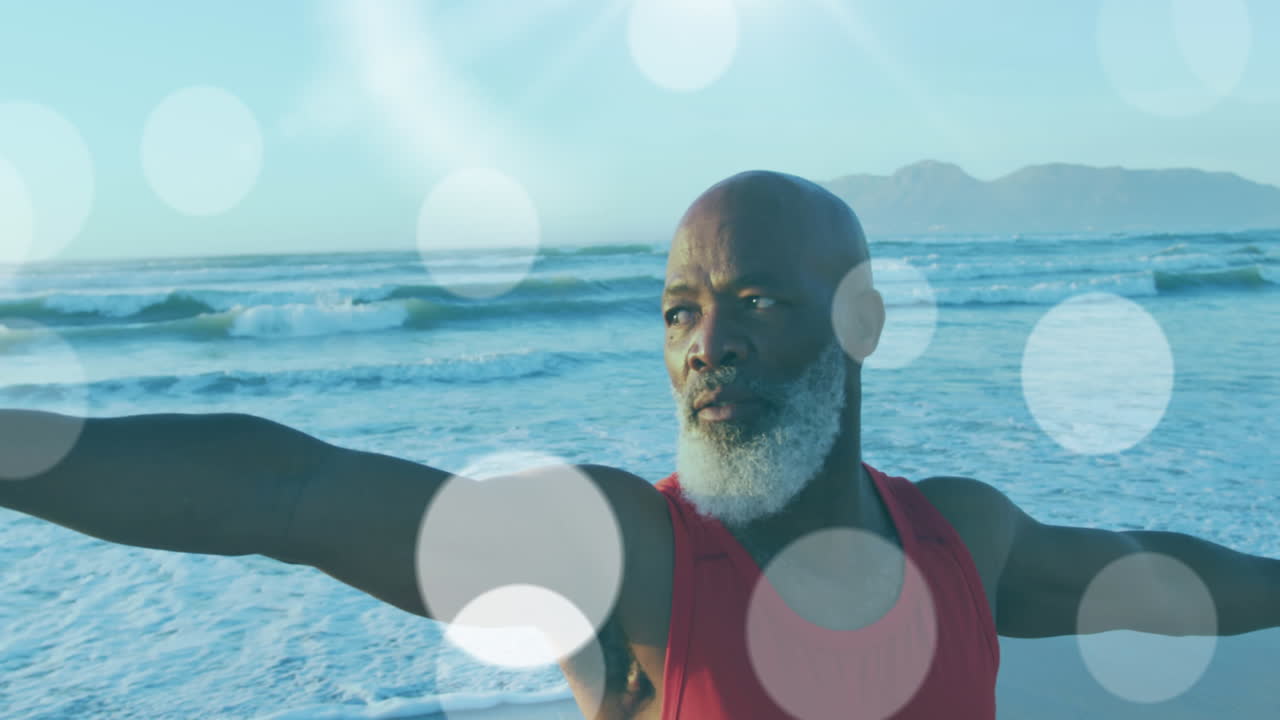 animación de un anciano afroamericano practicando yoga en la playa sobre puntos de luz