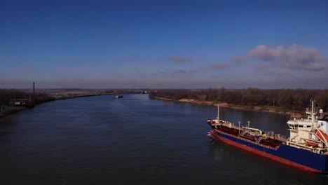 aerial view of a freight ship omg the river