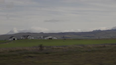 hand-held dolly shot of a small rural village in the countryside of iceland