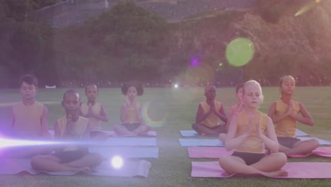 Animation-of-lights-over-diverse-pupils-practicing-yoga-outdoors