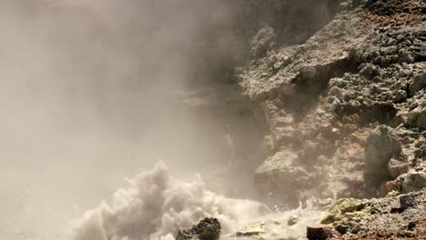 geothermal mud pool with bubbling liquid on whakaari white island