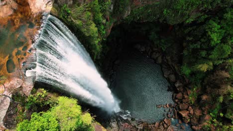 belmore falls, australia, drone circles around cascading waterfall