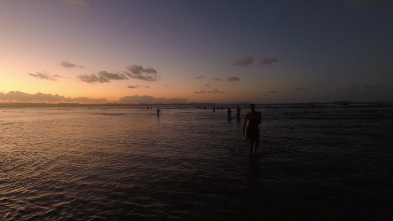 Sunset Video of Surfer Walking Towards Camera.
