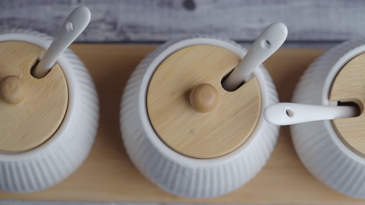 Close-up of containers with lids and spoons