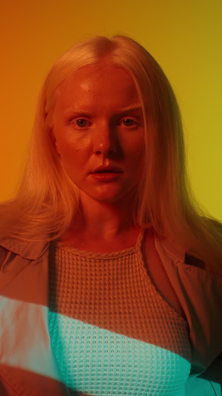 Blonde Woman Portrait in Red and Yellow Lighting