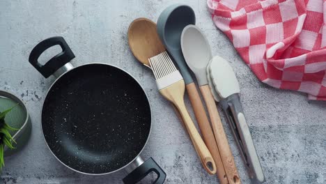 kitchen utensils on a grey surface