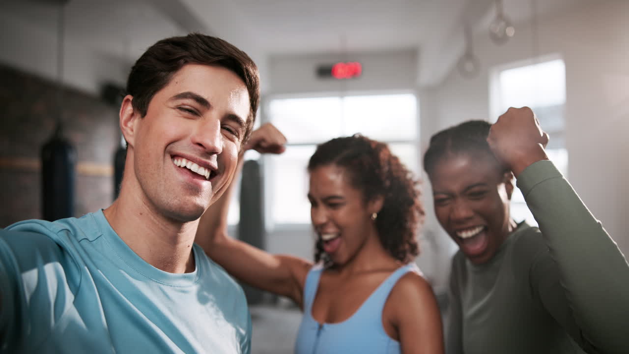 Group of friends celebrating a workout at the gym