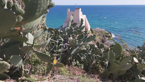 windy day over tower truglia in sperlonga with the sea in the background