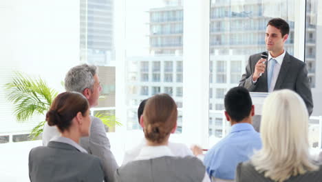 business people asking question during presentation