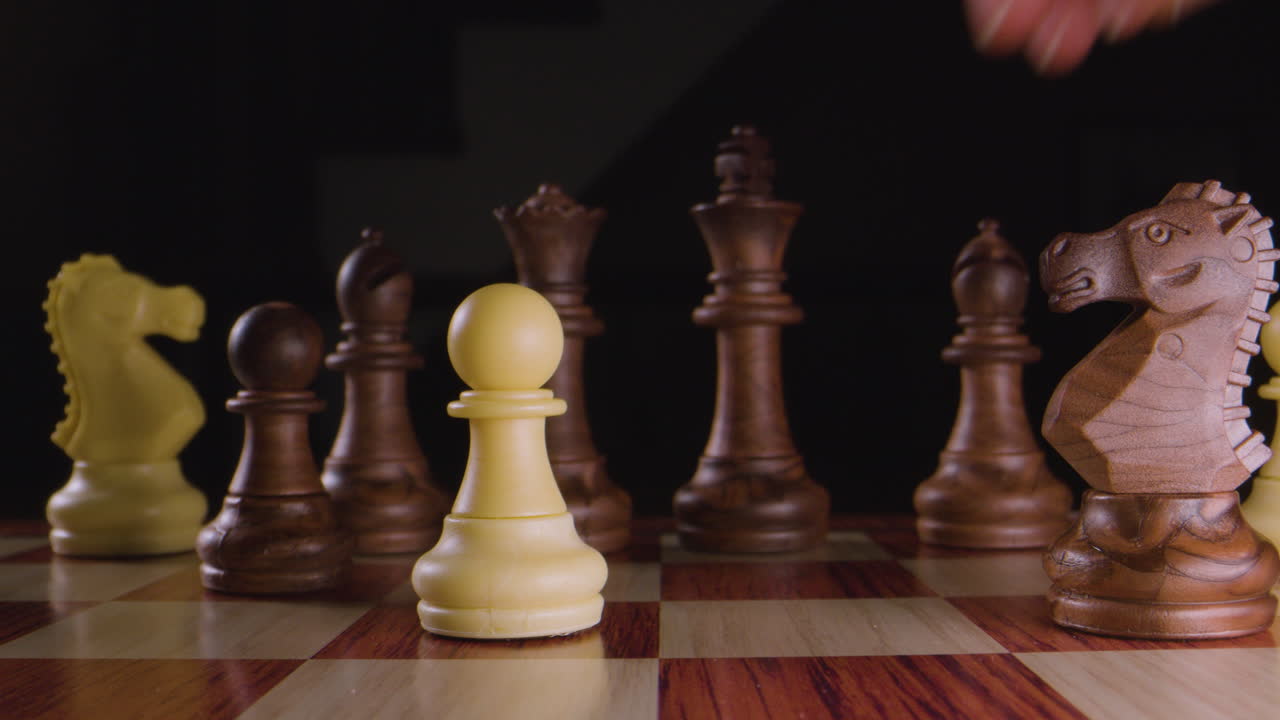 Chess. Bishop takes pawn. Macro slow motion.