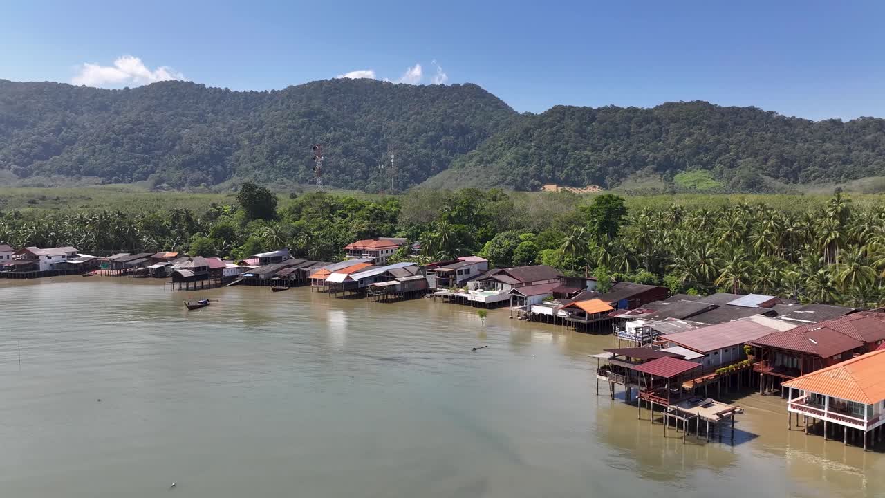 Lanta Old Town, Chinese fishing village with wooden huts on waterfront. Drone panoramic. Thailand