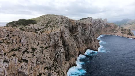 big cliff in mallorca coast drone shot