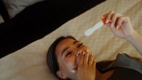 excited woman receiving positive pregnancy test result