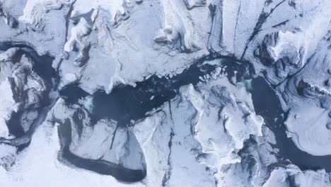 amazing frozen landscape of the fjaðra rglju fur canyon in iceland - aerial shot