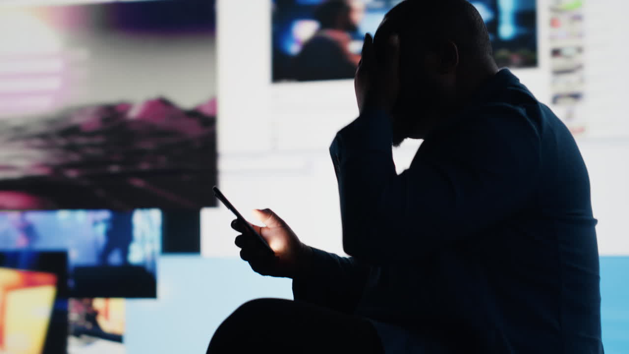 Modern guy holding his phone expressing harmful effects of social media