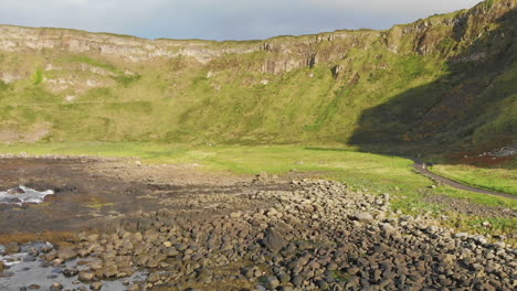 Aerial-view-of-the-rocky-shore-and-green-cliffs-near-Giant's-Causeway-in-Northern-Ireland