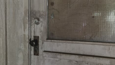 an old house with faded white painted wooden door - close up shot