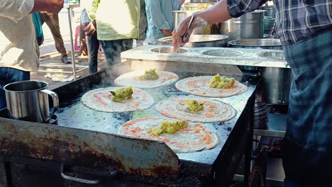 making of the crispy masala dosa in the indian street food outlet