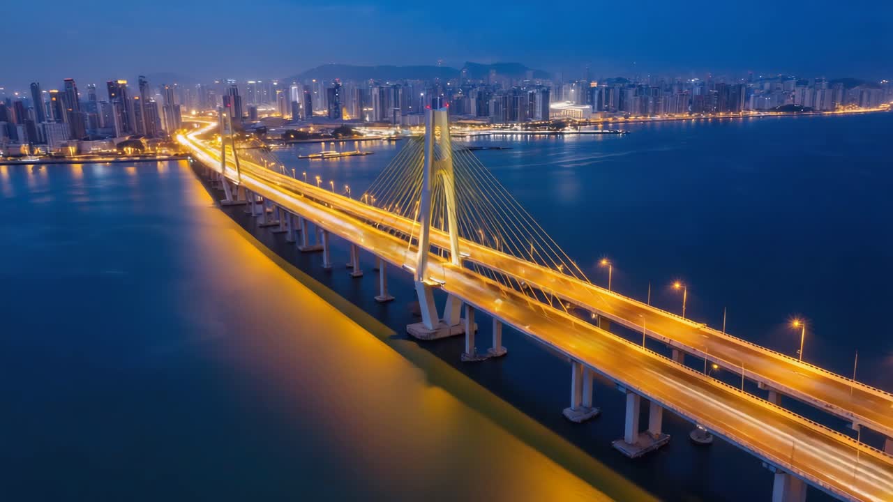 Illuminated Bridge and Cityscape at Night