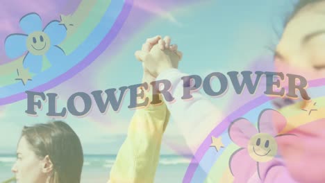 animation of flower power text with rainbow and flowers over two women holding hands