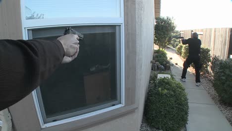 dea or swat officers with arms drawn pound on the door before performing a drug raid on a house 2