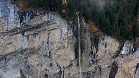 waterfall over the mountain rocks falling down