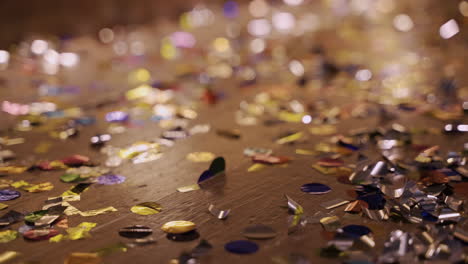 Close-Up-View-Of-Wooden-Floor-Full-Of-Confetti