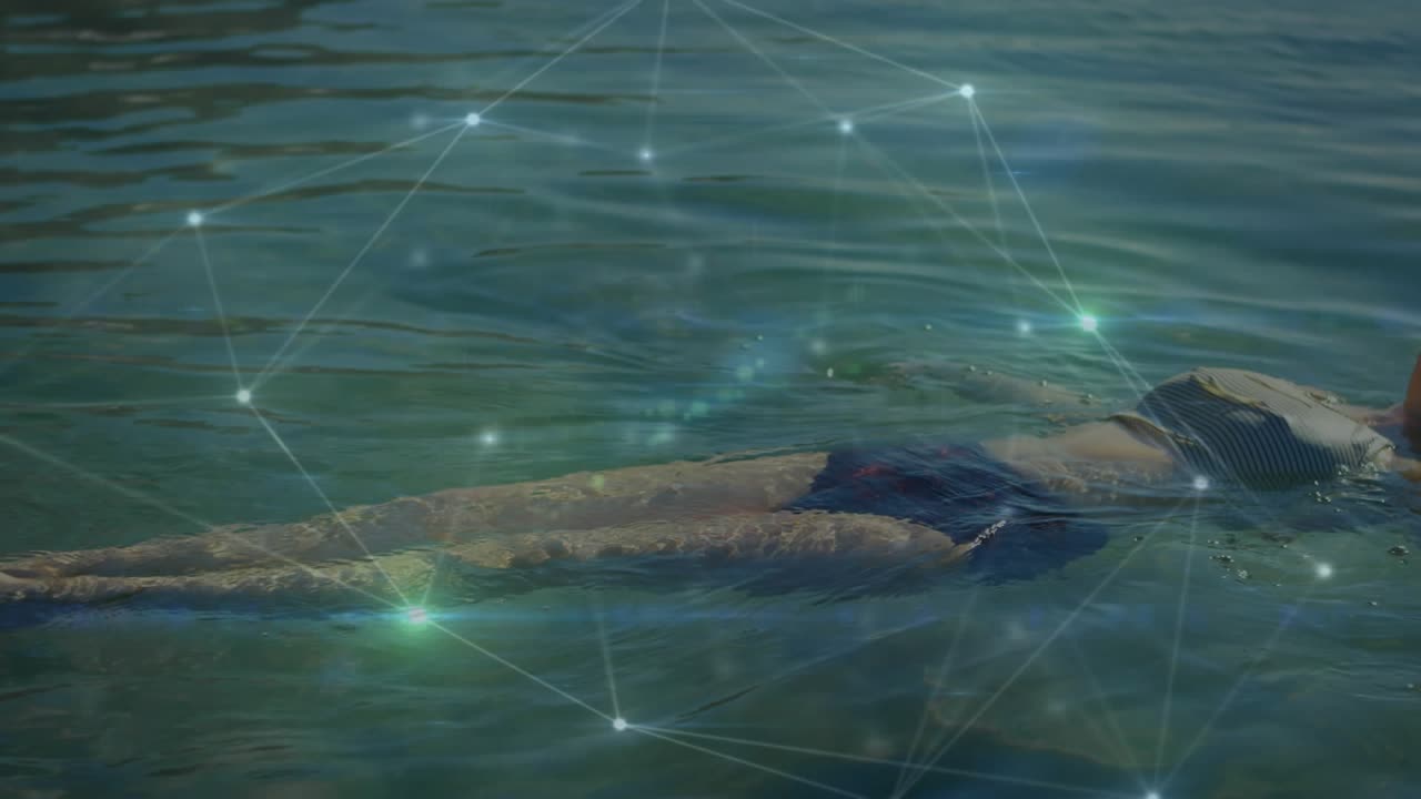 Woman floating on lake initiating glowing nodes and connecting lines overlay showcasing technology